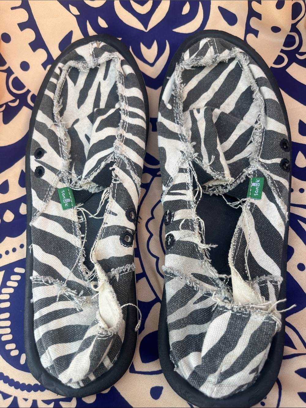 Sanuk Zebra-Print Slip-Ons in Black and White